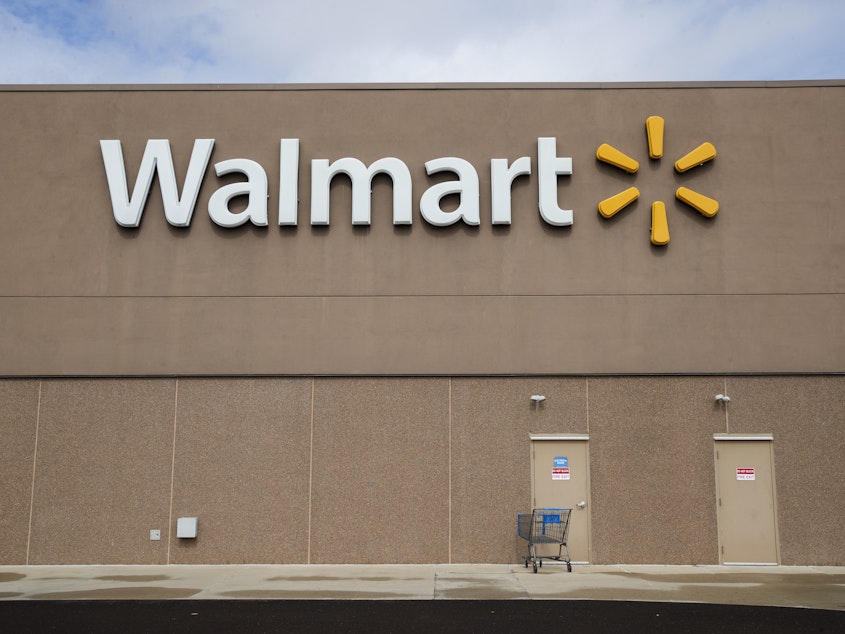 caption: Walmart announced a series of measures to safeguard against the coronavirus and urged shoppers to limit how often they visit its stores.