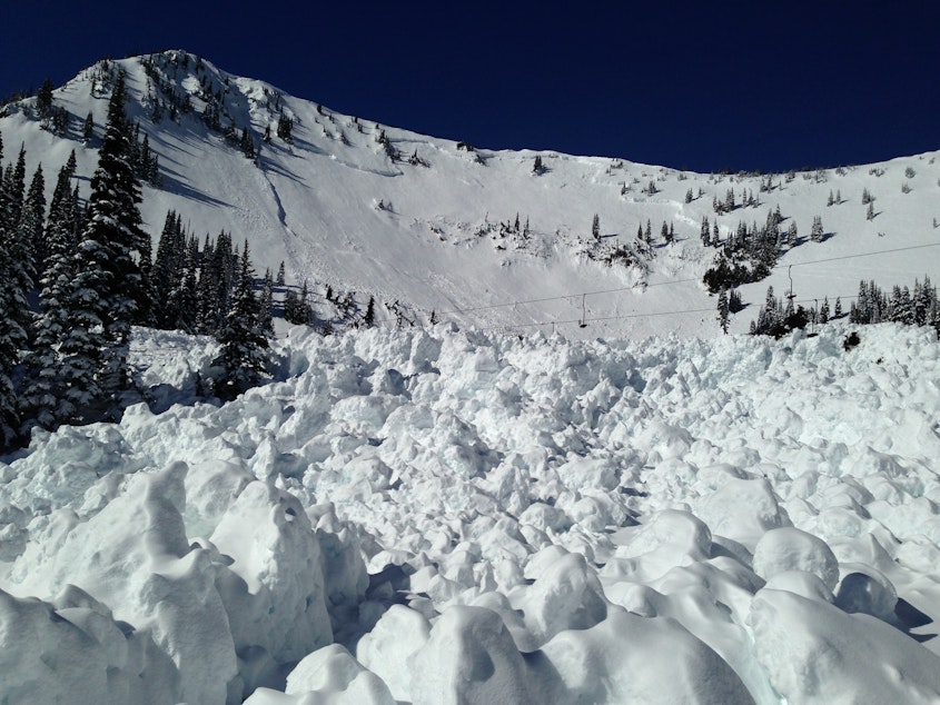 caption: The remains of a slab avalanche at Crystal Mountain.