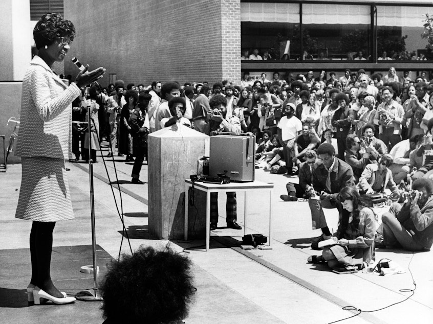 caption: Shirley Chisholm, the first Black woman elected to U.S. Congress was running for president in 1972 when she had a remarkable interaction with the pro-segregation George Wallace, then governor of Alabama. Her efforts to build bridges with him ultimately changed his point of view. She's pictured here giving a speech at Laney Community College during her presidential campaign.