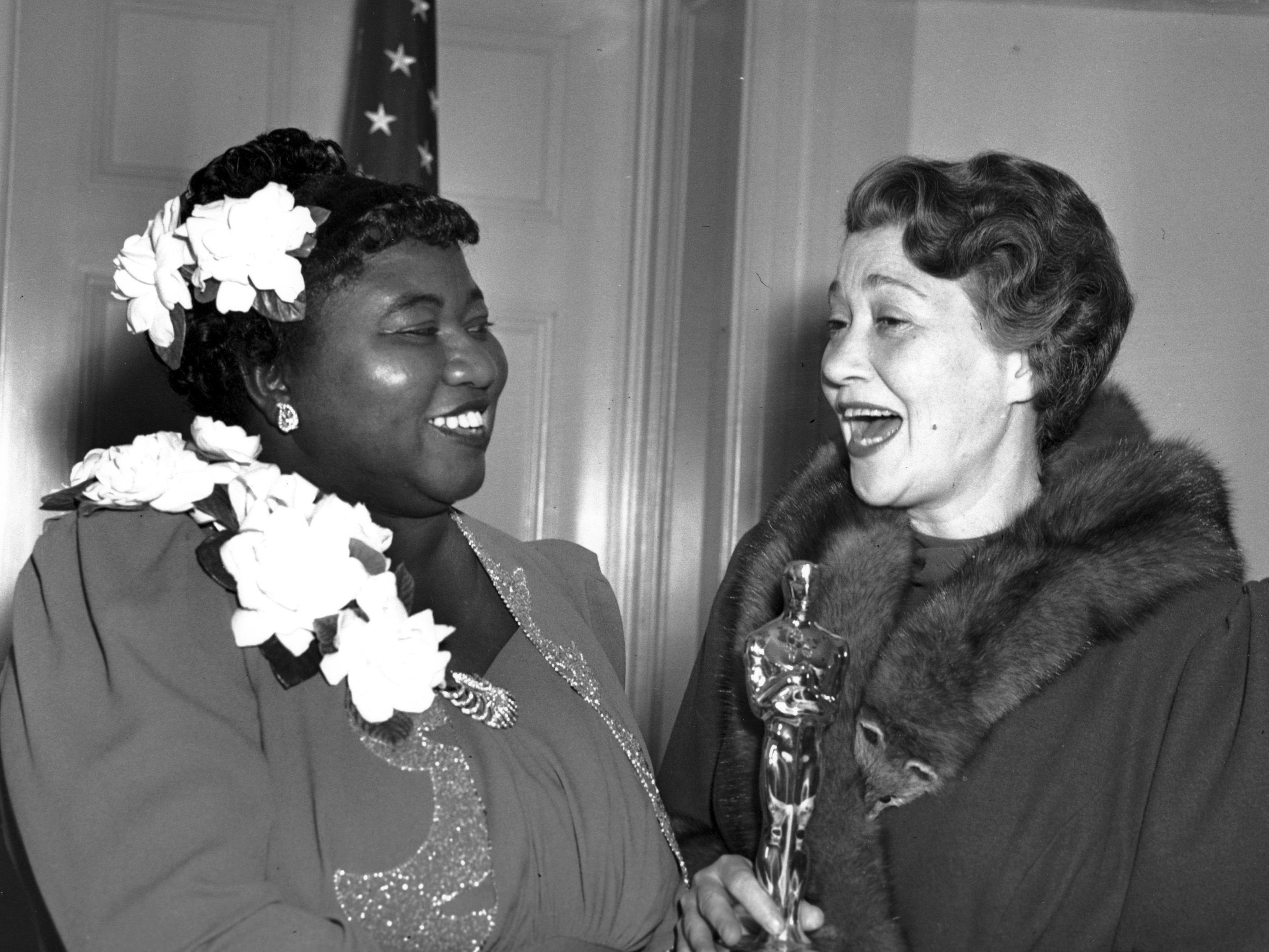 caption: Actress Hattie McDaniel, left, appears with actress Fay Bainter, right, the night McDaniel won best supporting actress for her role in the 1939 film <em>Gone With the Wind</em> in Los Angeles on Feb. 29, 1940. The Academy of Motion Pictures Arts and Sciences has created a replacement of McDaniel's Academy Award plaque that it is gifting to Howard University.