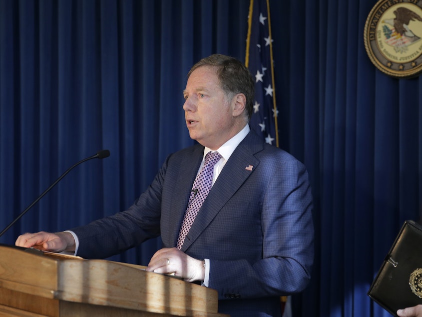 caption: U.S. Attorney for the Southern District of New York Geoffrey Berman speaks to reporters last year about two Florida men associated with President Trump's lawyer Rudolph Giuliani and the Ukraine investigation.