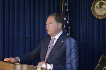 caption: U.S. Attorney for the Southern District of New York Geoffrey Berman speaks to reporters last year about two Florida men associated with President Trump's lawyer Rudolph Giuliani and the Ukraine investigation.