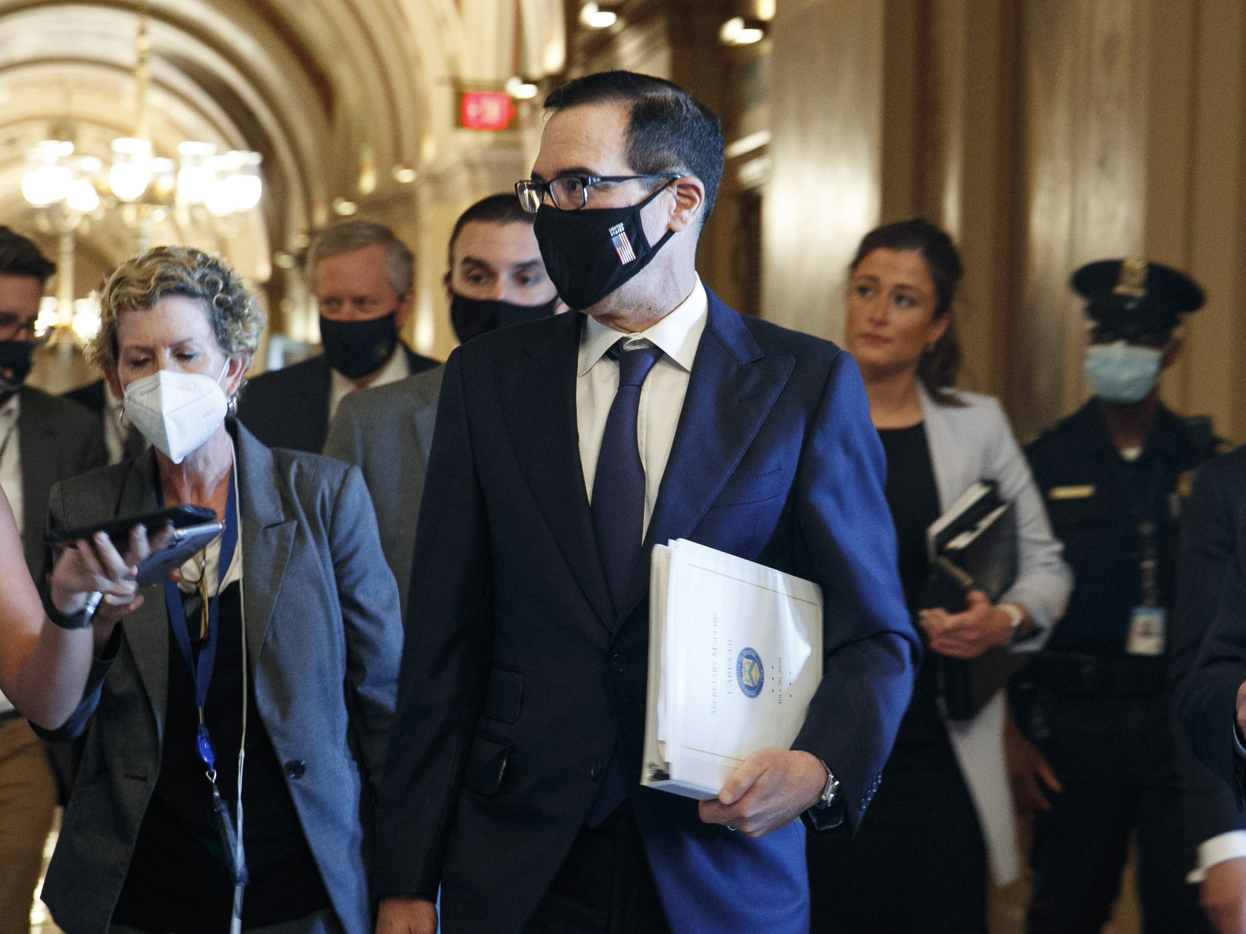 caption: Treasury Secretary Steven Mnuchin on Capitol Hill earlier this week. A White House proposal to cut federal unemployment benefits to a percentage of earlier wages could take months to implement, leaving millions with significantly reduced checks.