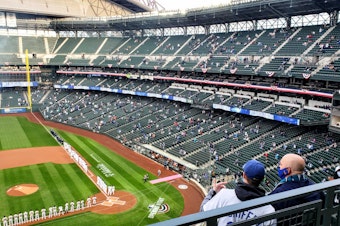 caption: Small clusters of fans dot T-Mobile Park stadium on Opening Day. Thursday, April 1, 2020