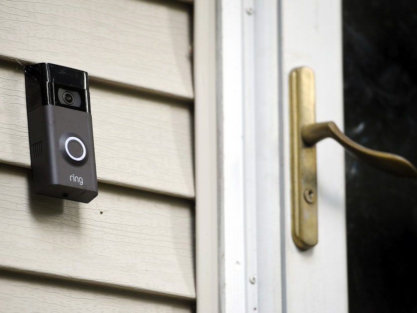 caption: A Ring doorbell camera is seen outside a home in Wolcott, Conn., on July 16, 2019. Amazon-owned Ring said it will stop allowing police departments to request doorbell camera footage from users, marking an end to a feature that has drawn criticism from privacy advocates.