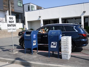 caption: With voting by mail set for a major expansion due to the pandemic, some worry that thousands of absentee ballots could be rejected because the postal service may not postmark the envelope.