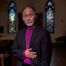 caption: Bishop Scott Hayashi: 'Three men entered. One jumped behind the counter where I was standing, put a gun to my side and pulled the trigger. Pffft! It was that fast.'