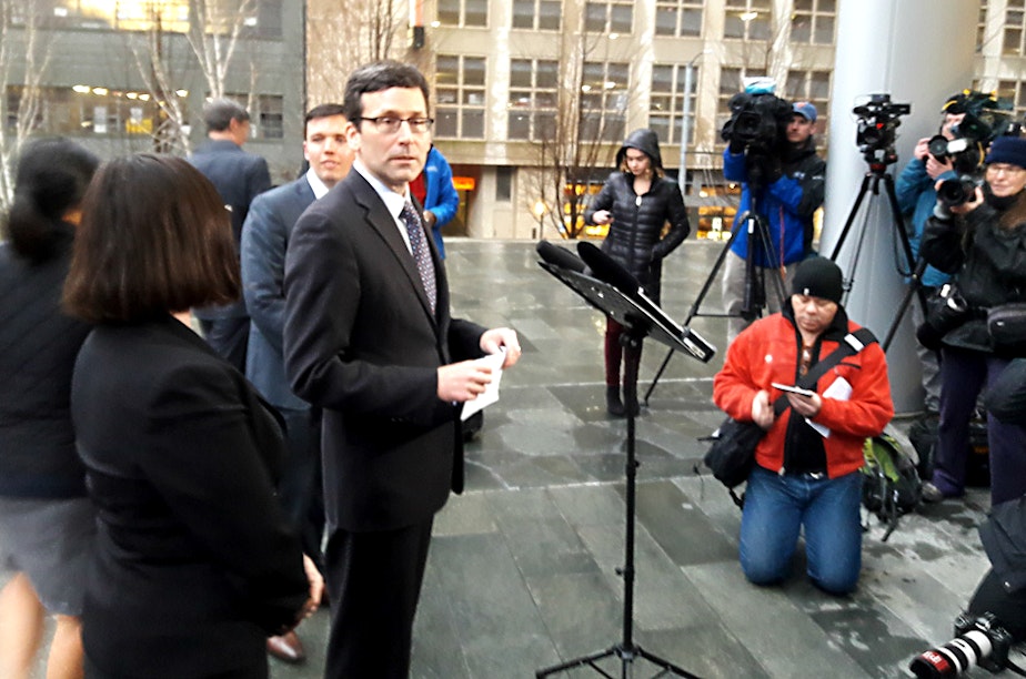 caption: Washington Attorney General Bob Ferguson prepares to talk to the media about a federal judge's ruling on the Trump refugee order.