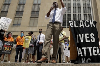 caption: Mayor Quinton Lucas talks to demonstrators during a rally in Kansas City, Mo., on June 5, to protest the death of George Floyd.