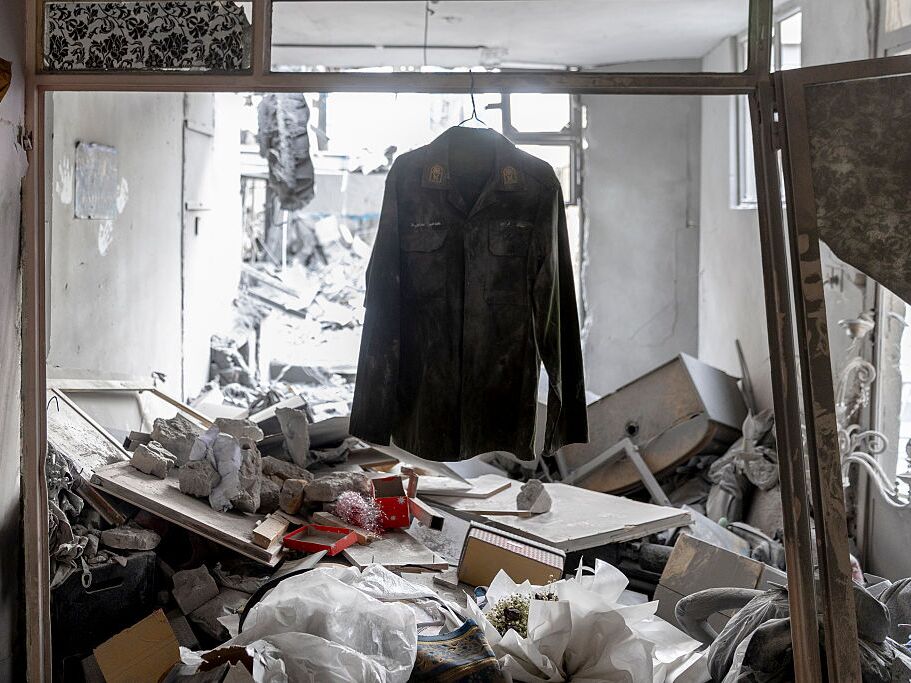 caption: A shirt is seen hanging Sunday amid the rubble in the Beryanak District in Tehran, Iran, after it was damaged by missile attacks two days before.