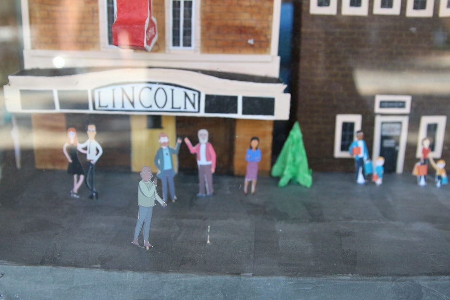 caption: A window display outside the Lincoln, prepared for a Tulip Festival window display competition