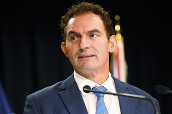 caption: New Zealand Police Minister Stuart Nash talks to reporters on Monday. The government has introduced a broad bill that would ban the types of weapons used in attacks at two mosques in March.