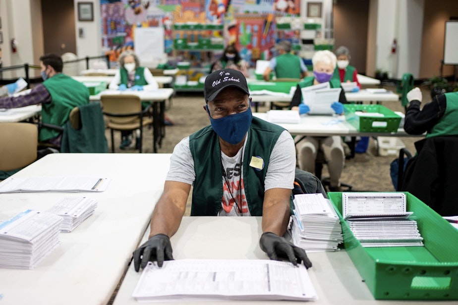 caption: Election judges verify and count ballots at the Denver Elections Division building on November 3, 2020 in Denver, Colorado. (CHET STRANGE/AFP via Getty Images)