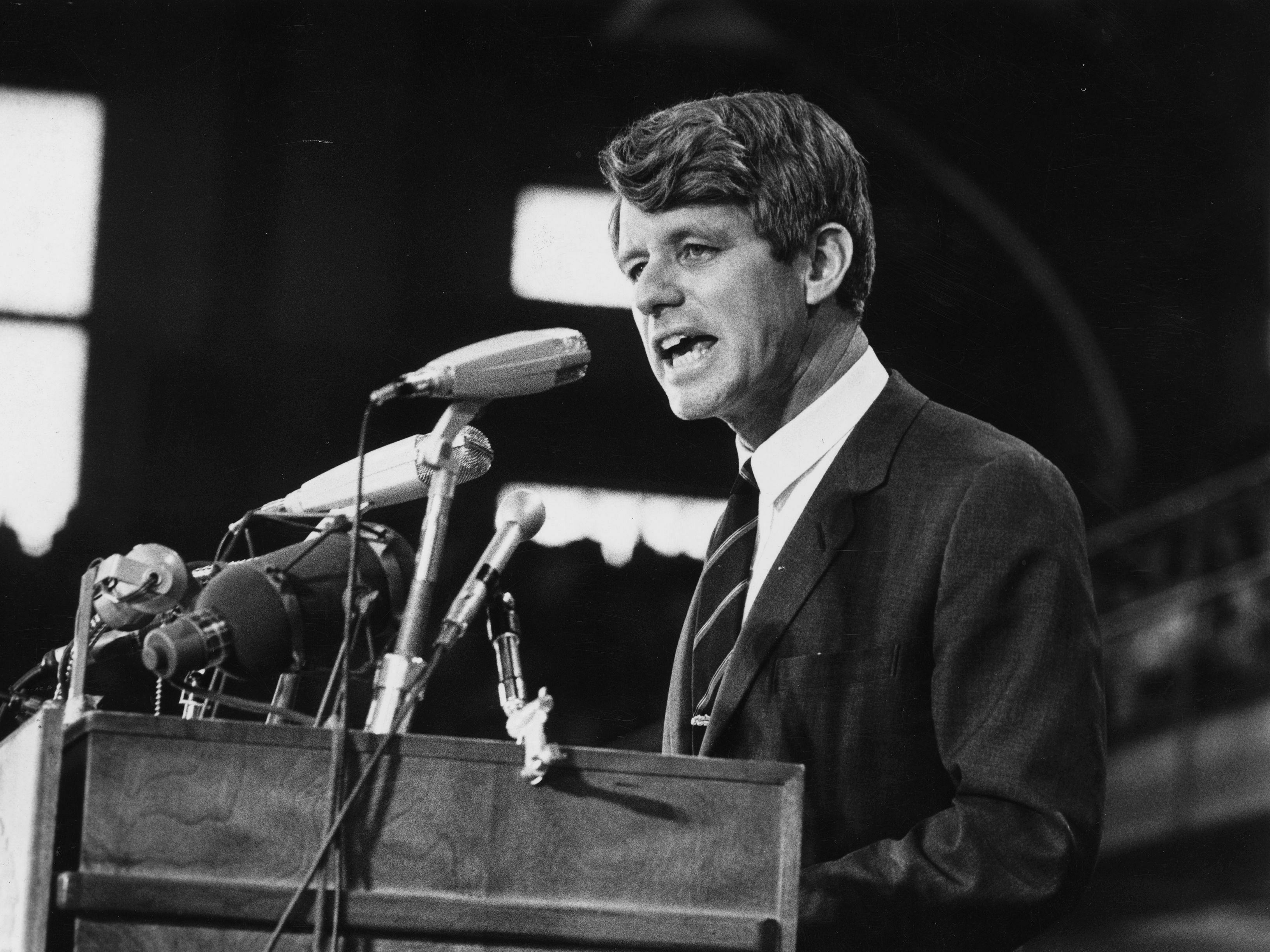 caption: Sen. Robert Kennedy speaks at an election rally in 1968.