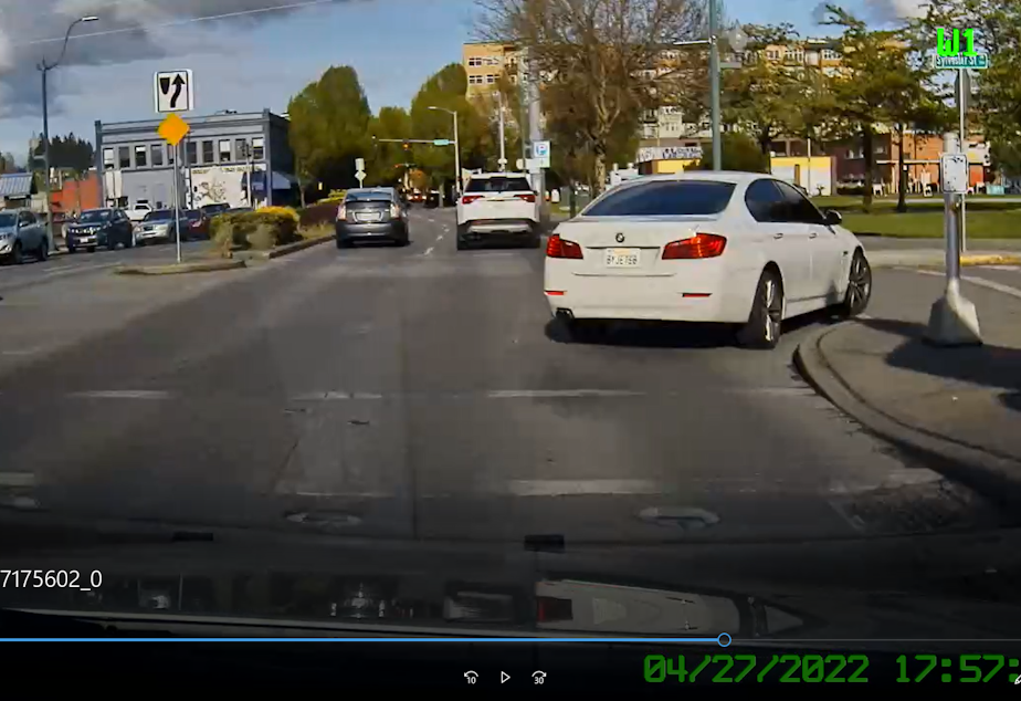 caption:  This Washington State Patrol dashcam video from April captures a white BMW with a stolen license plate failing to stop for a trooper. in Olympia The driver took off at a high rate of speed, but the trooper didn't give chase. Police in Washington say they're seeing a big spike in drivers failing to stop for their lights and sirens following passage of a law that severely restricts when police can engage in a pursuit.