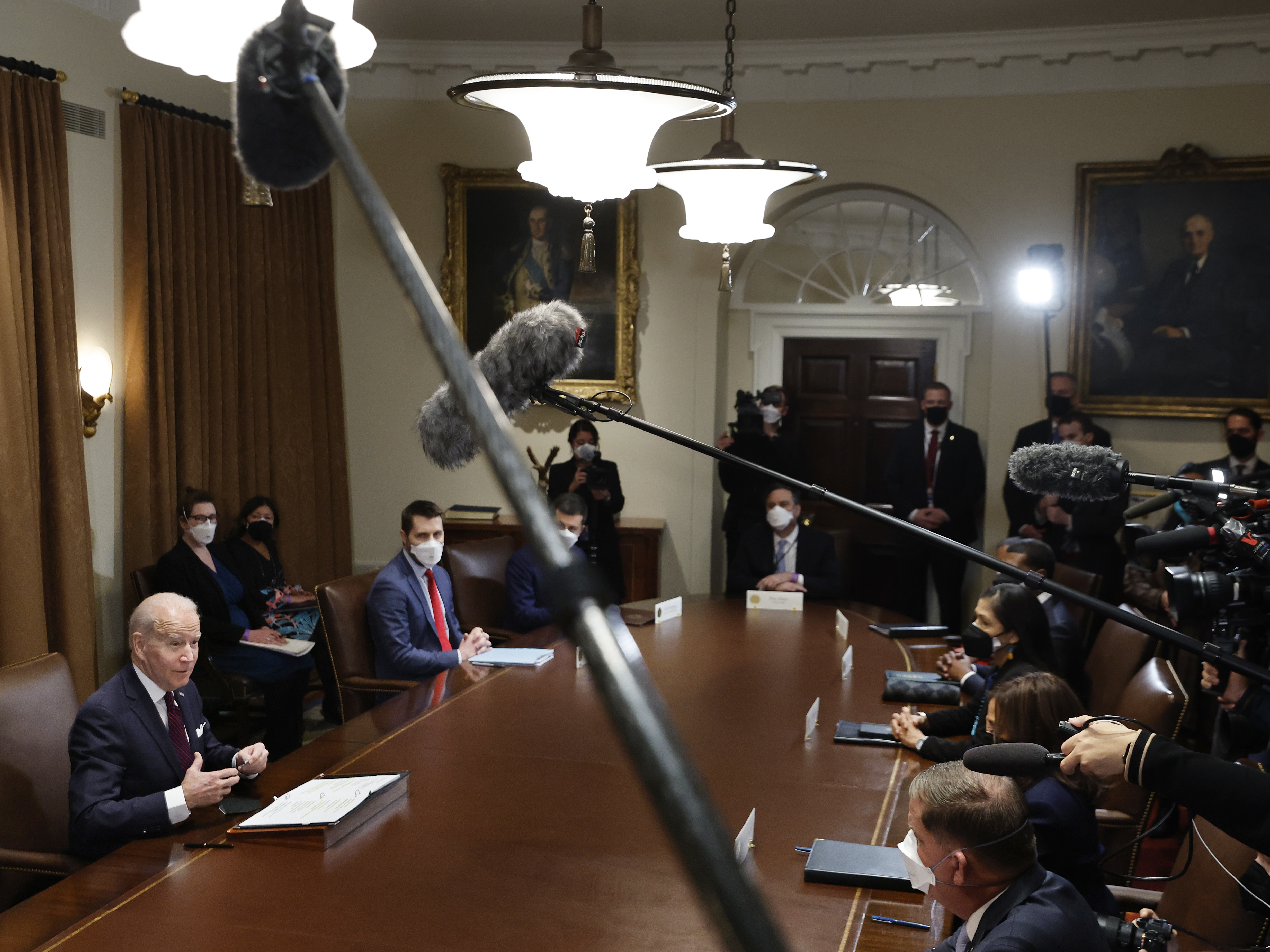 caption: President Biden planned to talk about infrastructure on the anniversary of his inauguration. But first, he had to clean up some comments he had made about Russia and Ukraine.