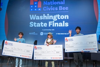 caption: The 2023 Washington Civics Bee finals were held at the Museum of Flight on Thursday, June 1, 2023. The winners were: first place, Benjamin Wu; second place, Devin Spector Van Zee; and third-place, Ye Joon Ameling. 