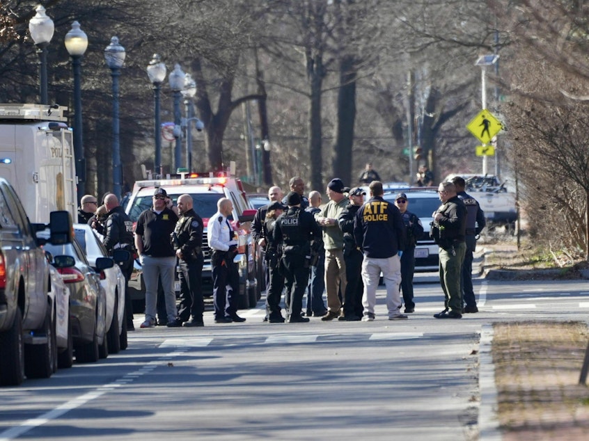 caption: Multiple law enforcement agencies arrived at the Israeli Embassy on Sunday afternoon after a man set himself on fire infront of the building.