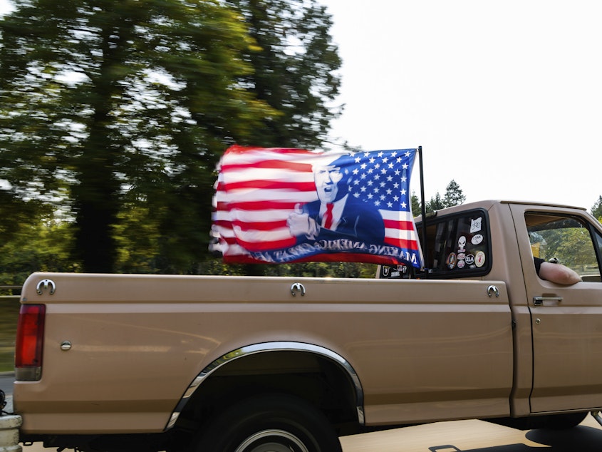 caption: A caravan of vehicles make their way along the Interstate 205 South freeway during the "Oregon for Trump 2020 Labor Day Cruise Rally," at Clackamas Community College in Oregon City, Ore., on Sept. 7, 2020.