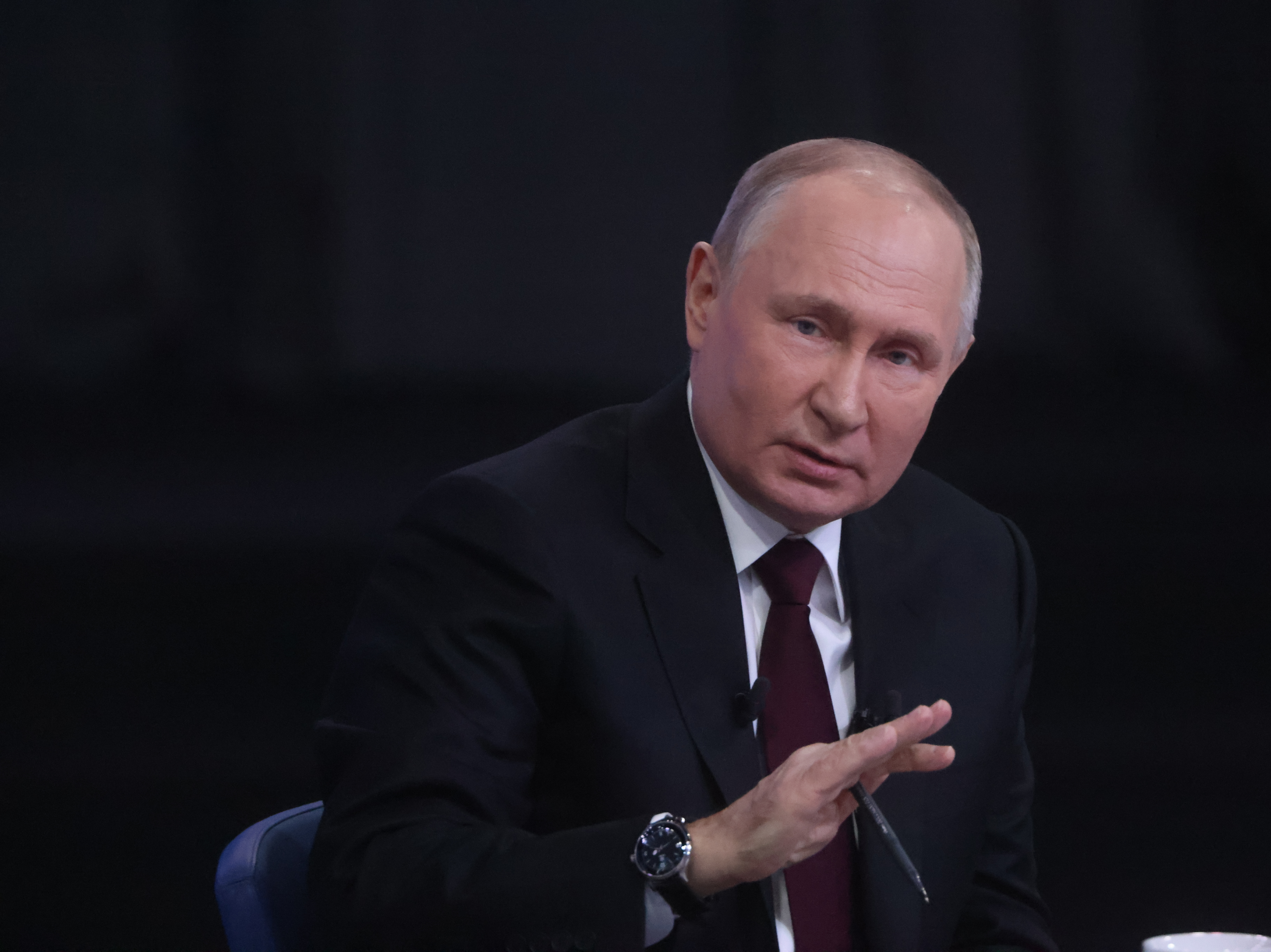 caption: Russian President Vladimir Putin gestures during his combined call-in-show and annual press conference, on Dec. 14, in Moscow, Russia.