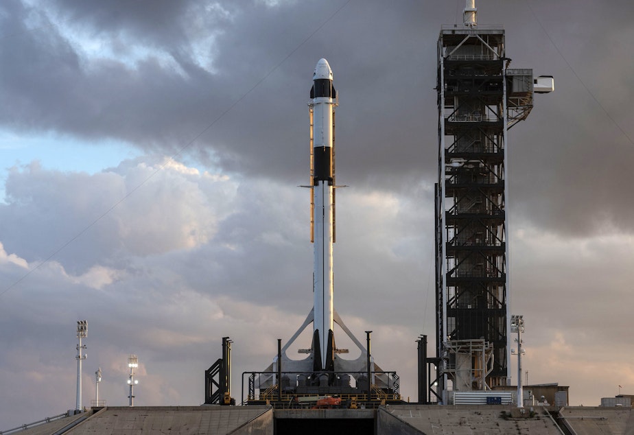 caption: Two astronauts will launch to the International Space Station aboard a new capsule built by the company SpaceX.