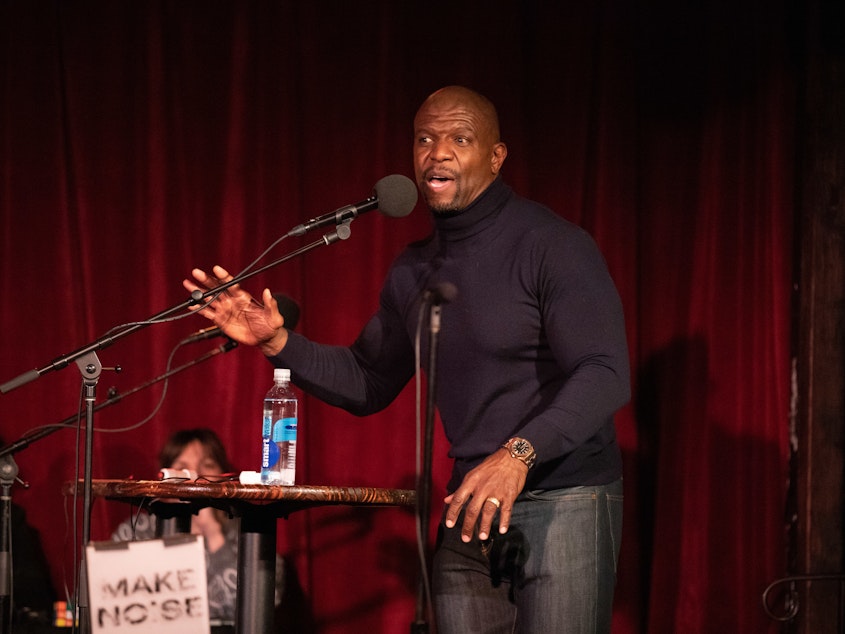 caption: Terry Crews plays a game on <em>Ask Me Another</em> at the Bell House in Brooklyn, New York.