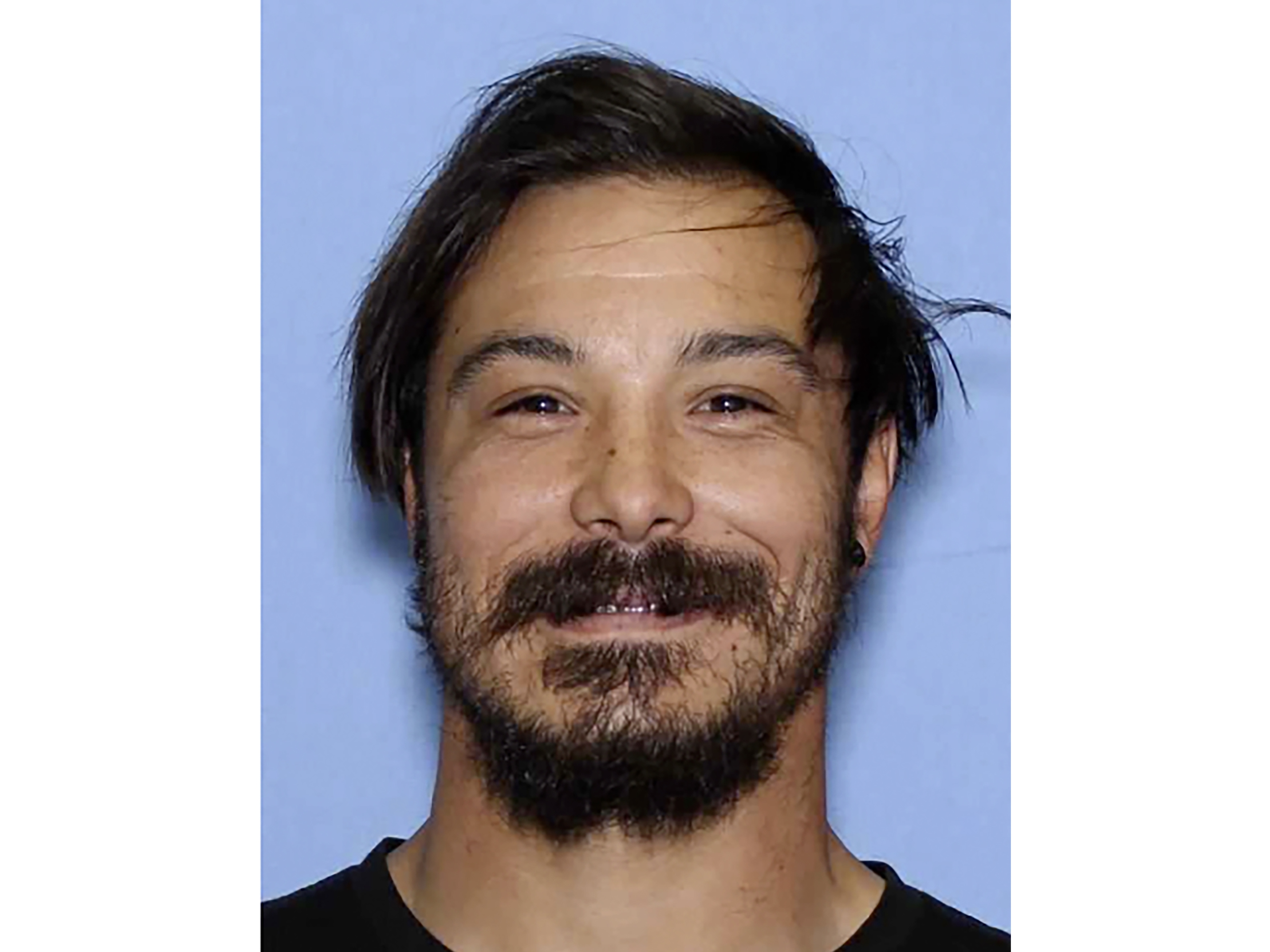 caption: An undated photo of Travis Decker, the Washington state father who is wanted for murder after his three young daughters were reported missing and then found dead.