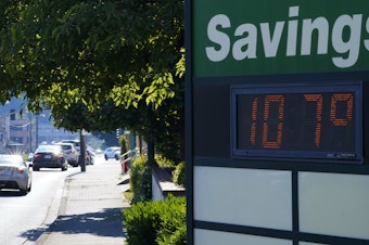 caption: A display at an Olympia Federal Savings branch shows a temperature of 107 degrees Fahrenheit, Monday, June 28, 2021, in the early evening in Olympia, Wash. 
