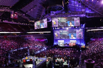 caption: The hub of the action for The International - a DOTA2 competition held last weekend at Key Arena.