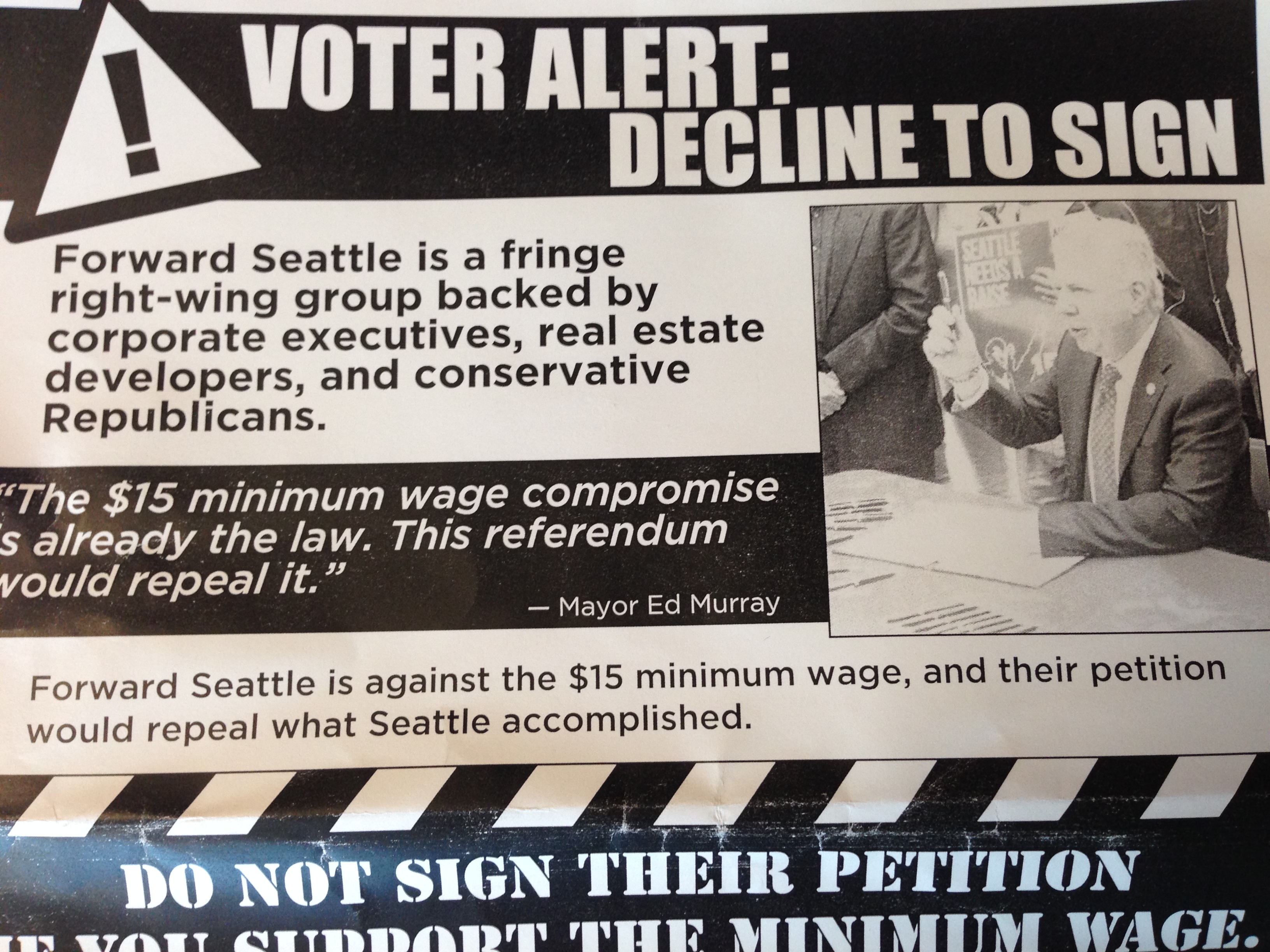 caption: Leaflet from supporters of $15 an hour minimum wage warns voters that the Forward Seattle petition campaign seeks to repeal the new law. 