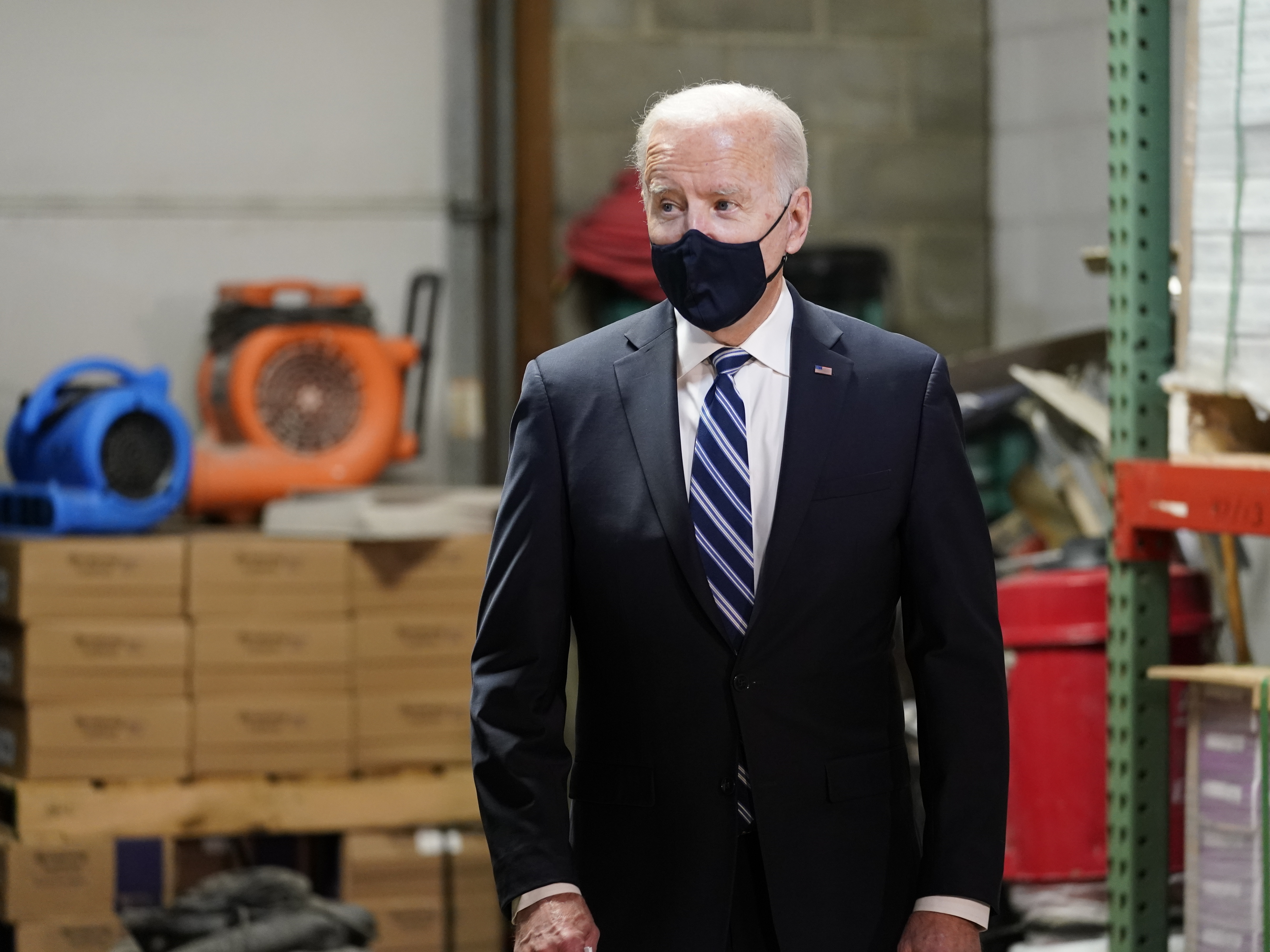 caption: President Joe Biden at Smith Flooring, Inc., in Chester, Pa., Tuesday