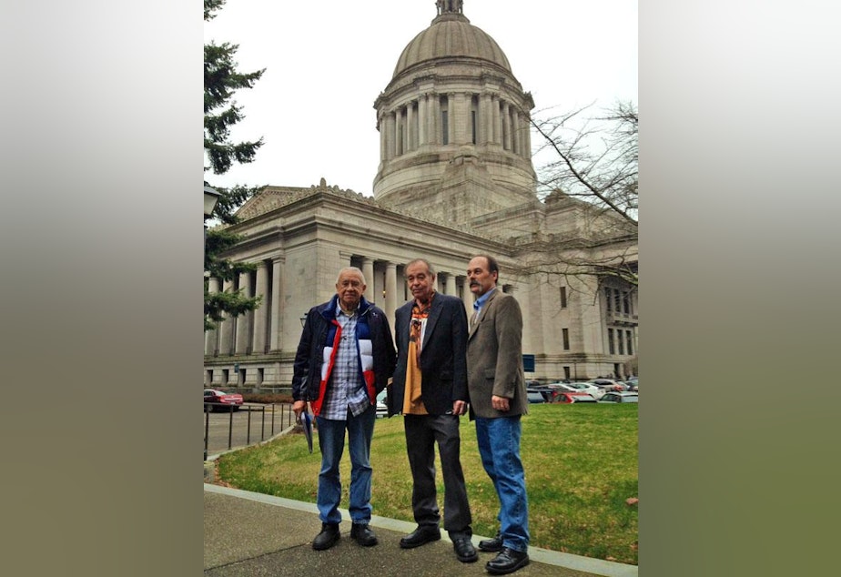 caption: Billy Frank, Jr., a veteran of the fish wars, Hank Adams, a tribal advocate, and Shawn Yanity, chairman of the Stillaguamish Tribe confer in Olympia in January.