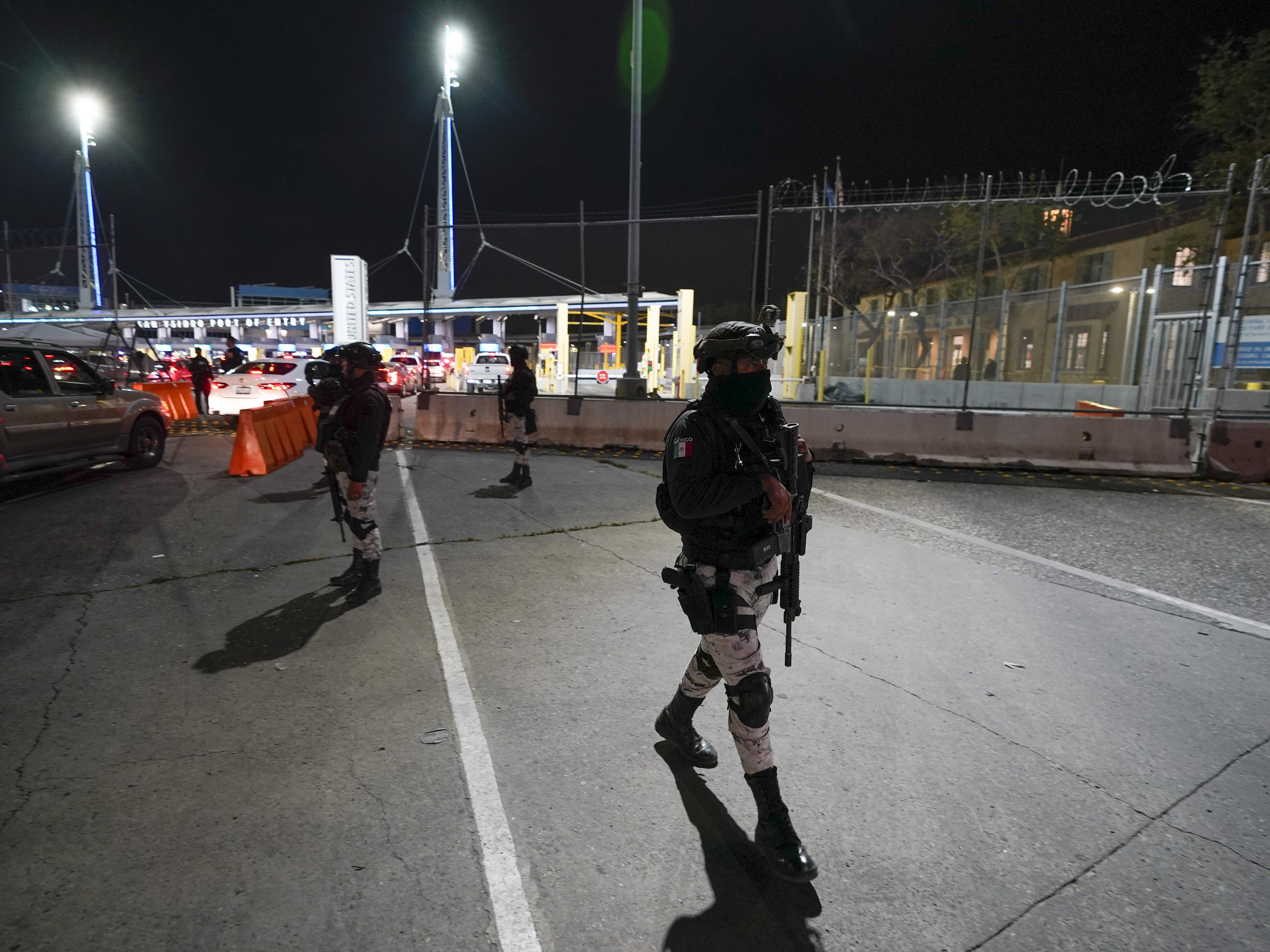 caption: Mexican National Guards patrol among the lanes of cars entering the San Ysidro Port of Entry in Tijuana, Mexico, May 11, 2023. Montserrat Caballero, the mayor of the Mexican border city of Tijuana, said on June 12, 2023 she has decided to go live at an army base for her own safety, after she received threats.