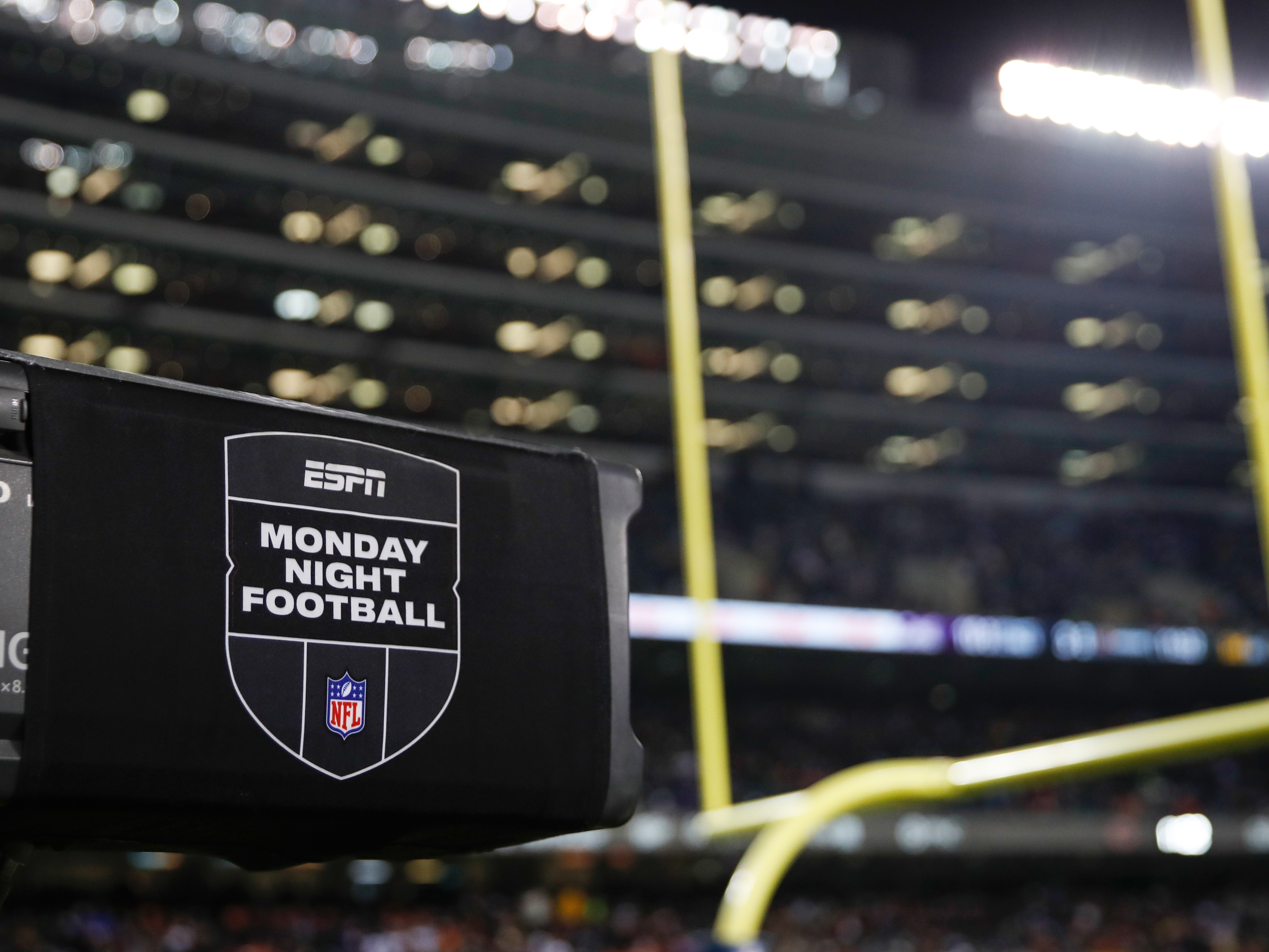 caption: ESPN Monday Night Football TV camera is seen during the second half of an NFL football game between the Chicago Bears and Minnesota Vikings on Dec. 20, 2021, in Chicago.