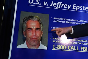 caption: A picture of Jeffrey Epstein from July 8, 2019, when federal prosecutors charged the financier with sex trafficking of minors. Epstein died later that year by suicide while in federal custody.