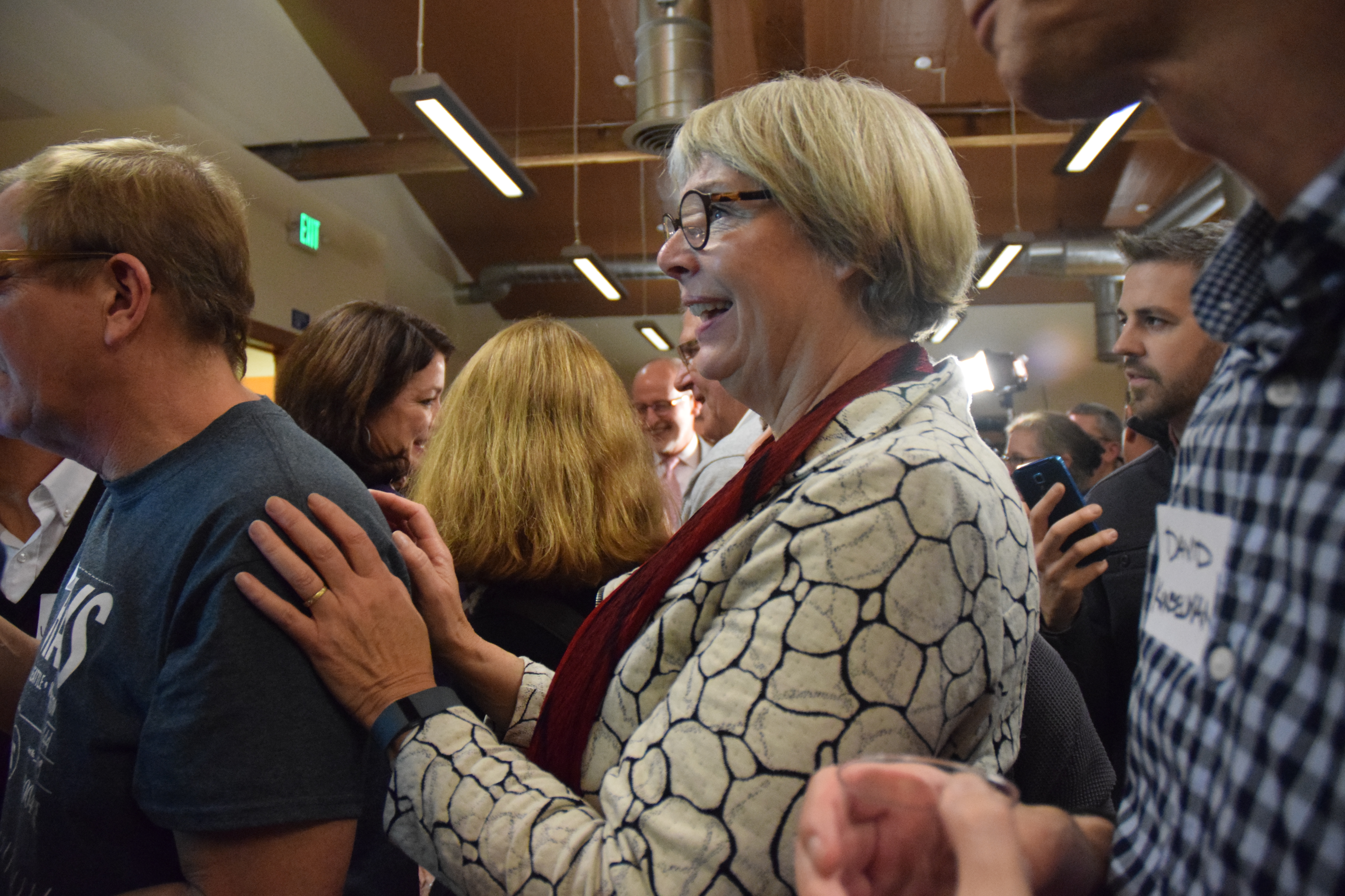 caption: District 7 candidate Sally Bagshaw watches a screen for the first results of the election on Tuesday night, discovering that she was leading her opponent 80 percent to 19 percent.