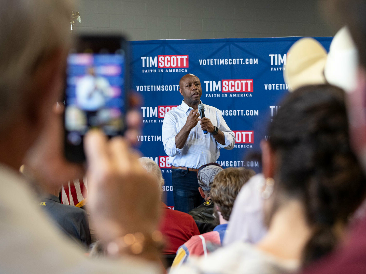 caption: South Carolina Sen. Tim Scott holds his first town hall as a declared Republican presidential candidate at Novelty Machine and Supply Co. in Sioux City, Iowa, on May 24.