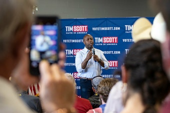 caption: South Carolina Sen. Tim Scott holds his first town hall as a declared Republican presidential candidate at Novelty Machine and Supply Co. in Sioux City, Iowa, on May 24.
