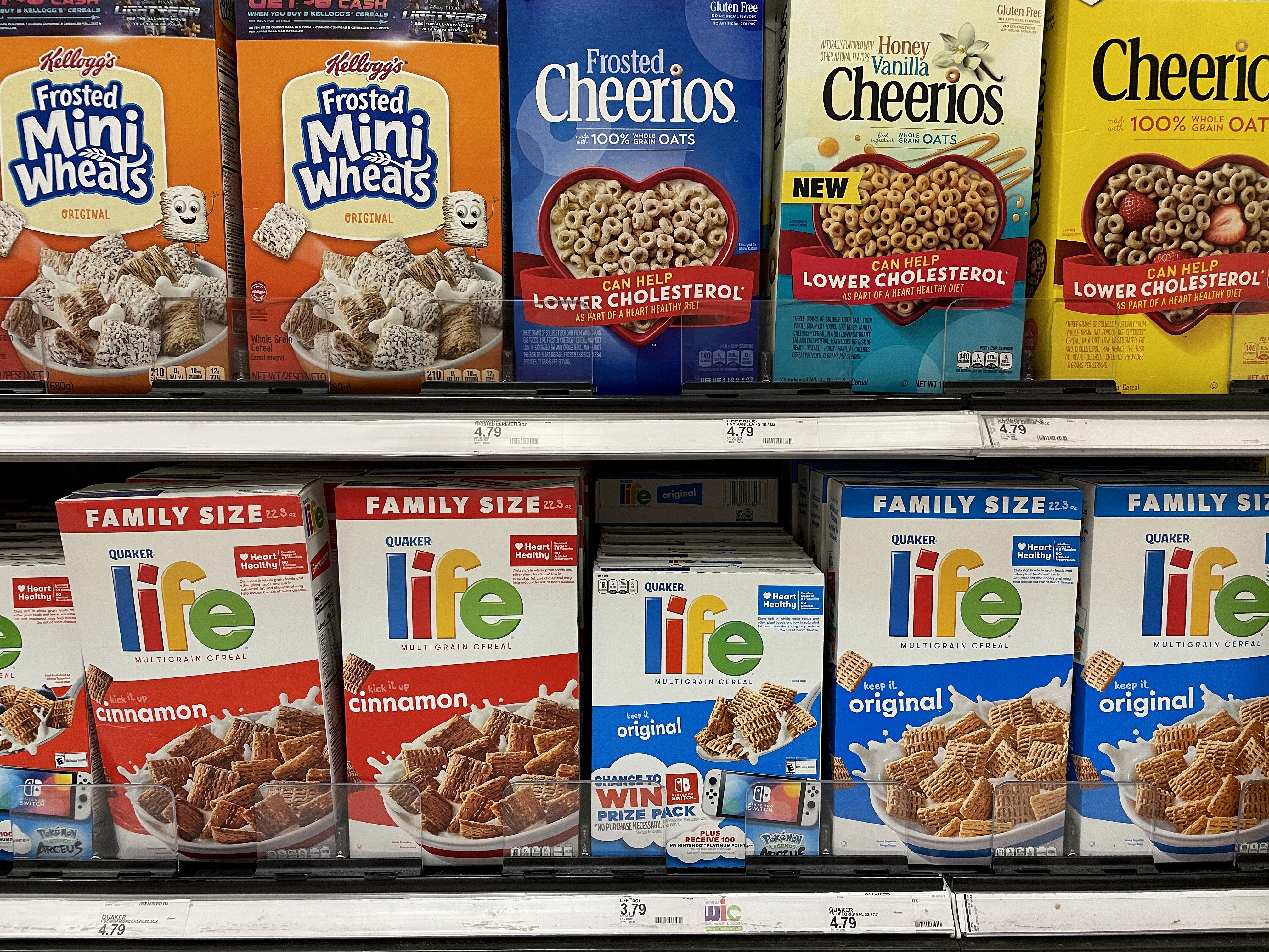 caption: Boxes of cereal are displayed on a shelf at a Target store in July 2022 in San Rafael, Calif. Manufacturers are using "shrinkflation" techniques as costs to produce goods increase. Some are making the packaging smaller but charging the same prices as they were prior to the reduction in size.