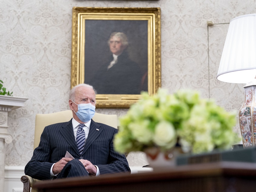 caption: President Biden spoke with the family of George Floyd on Monday as they await a verdict in the trial of former Minneapolis police officer Derek Chauvin. Above, Biden meets with members of Congress to discuss his jobs plan in the Oval Office on Monday.