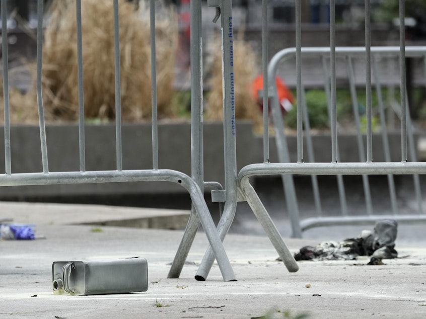 caption: A metal can sits on the ground at the scene where a man lit himself on fire in a park outside Manhattan criminal court on Friday in New York.