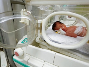 caption: A Palestinian baby girl, saved from the womb of her mother Sabreen Al-Sakani, who was killed in an Israeli strike along with her husband Shukri Jouda and her daughter Malak, lies in an incubator at the Emirati hospital in Rafah in the southern Gaza Strip, April 21.