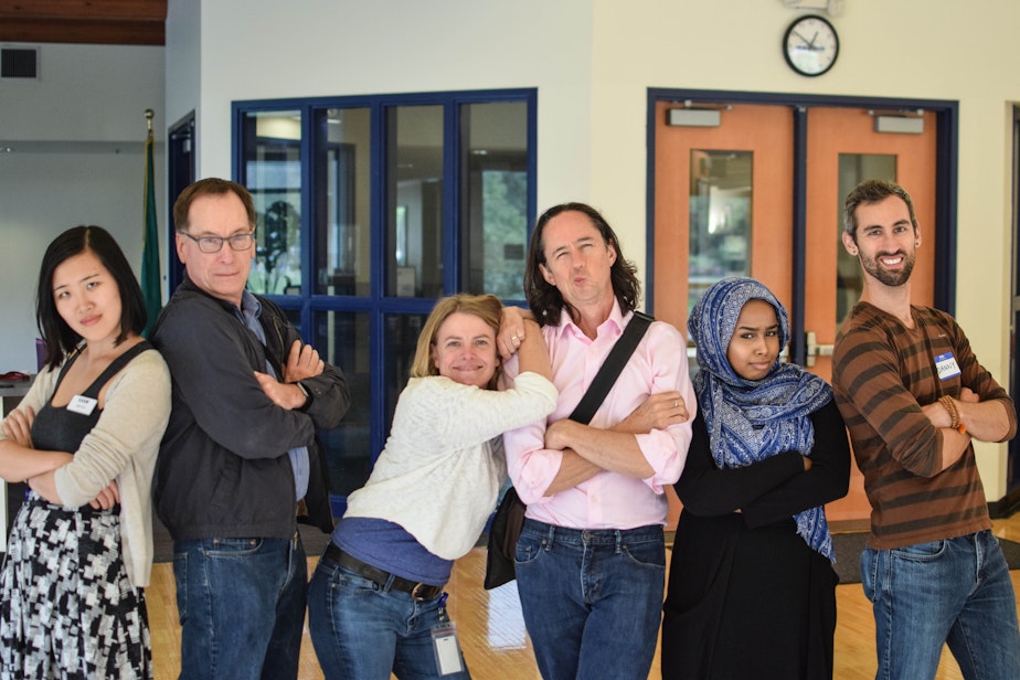 caption: Ross Reynolds and KUOW staff members pose after wrapping up an "Ask a..." event.