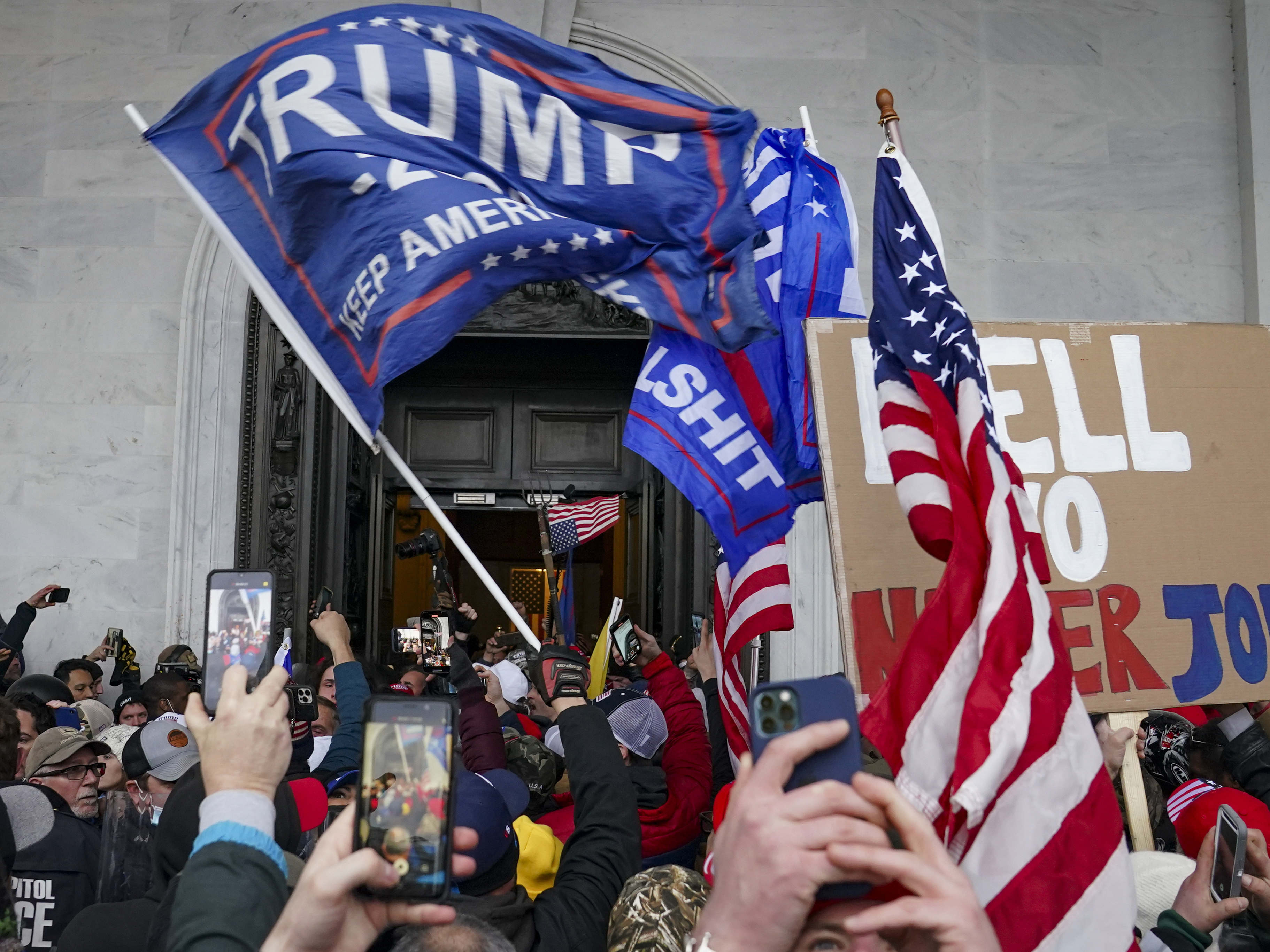 caption: Rioters break into the U.S. Capitol on Jan. 6.