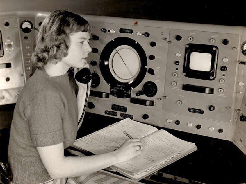 caption: Virginia Norwood sits at the Storm Detector Radar Set at the Army Signal Corps Laboratories in New Jersey in a photo displayed at the Institute for Radio Engineers Convention, Spring 1950.