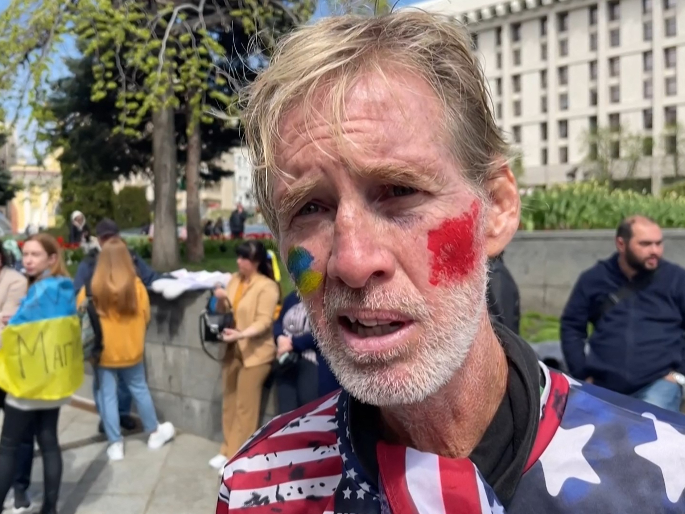 caption: This screengrab taken from AFPTV on Monday shows Ryan Wesley Routh speaking at a rally to urge foreign leaders and international organizations to help provide humanitarian corridors to evacuate Ukrainians from Mariupol in April 2022.