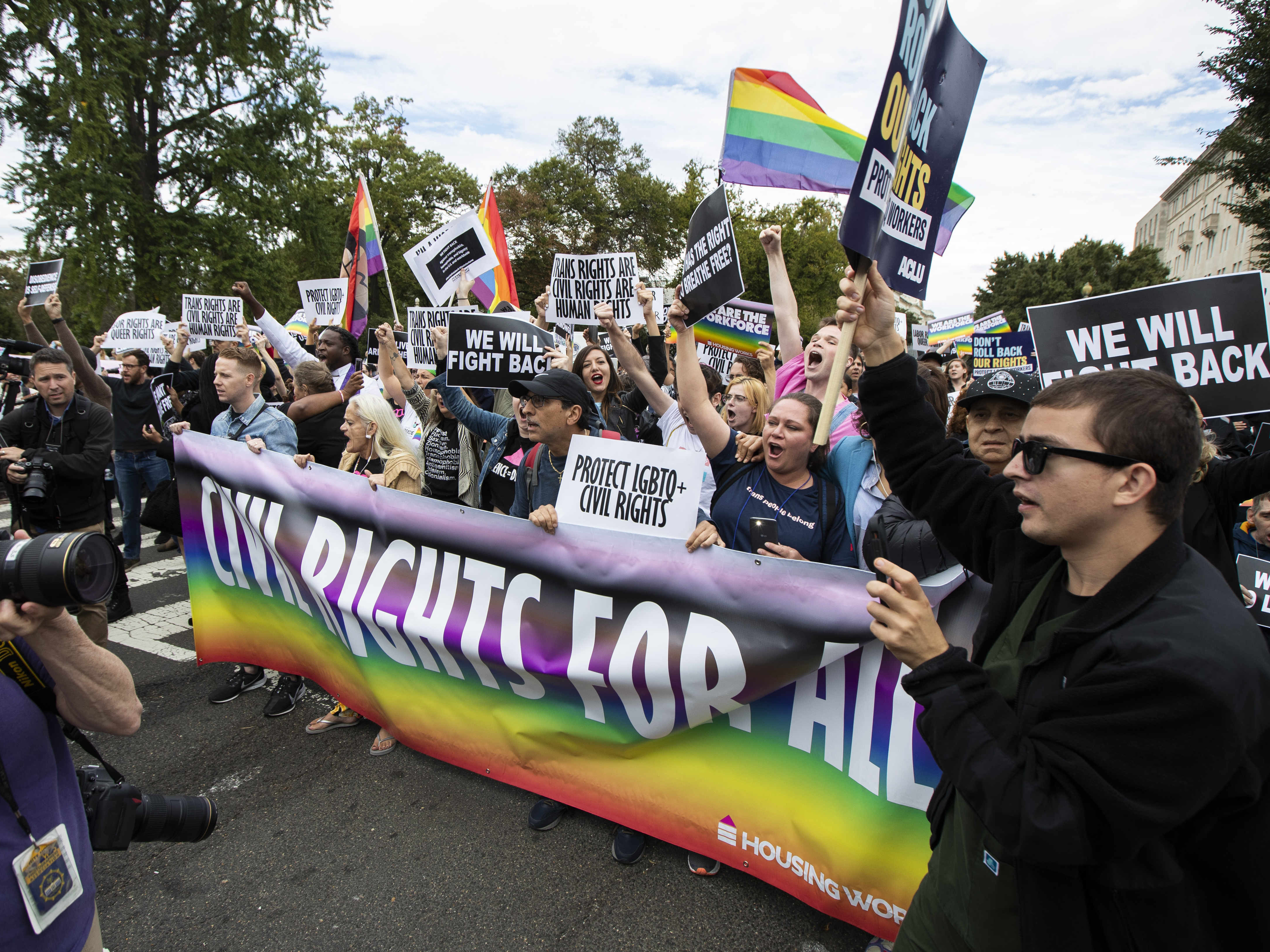 caption: Cases about transgender people and their rights have been working their way through the court system for years. Here, people demonstrate in favor of trans rights in front of the Supreme Court in 2019.