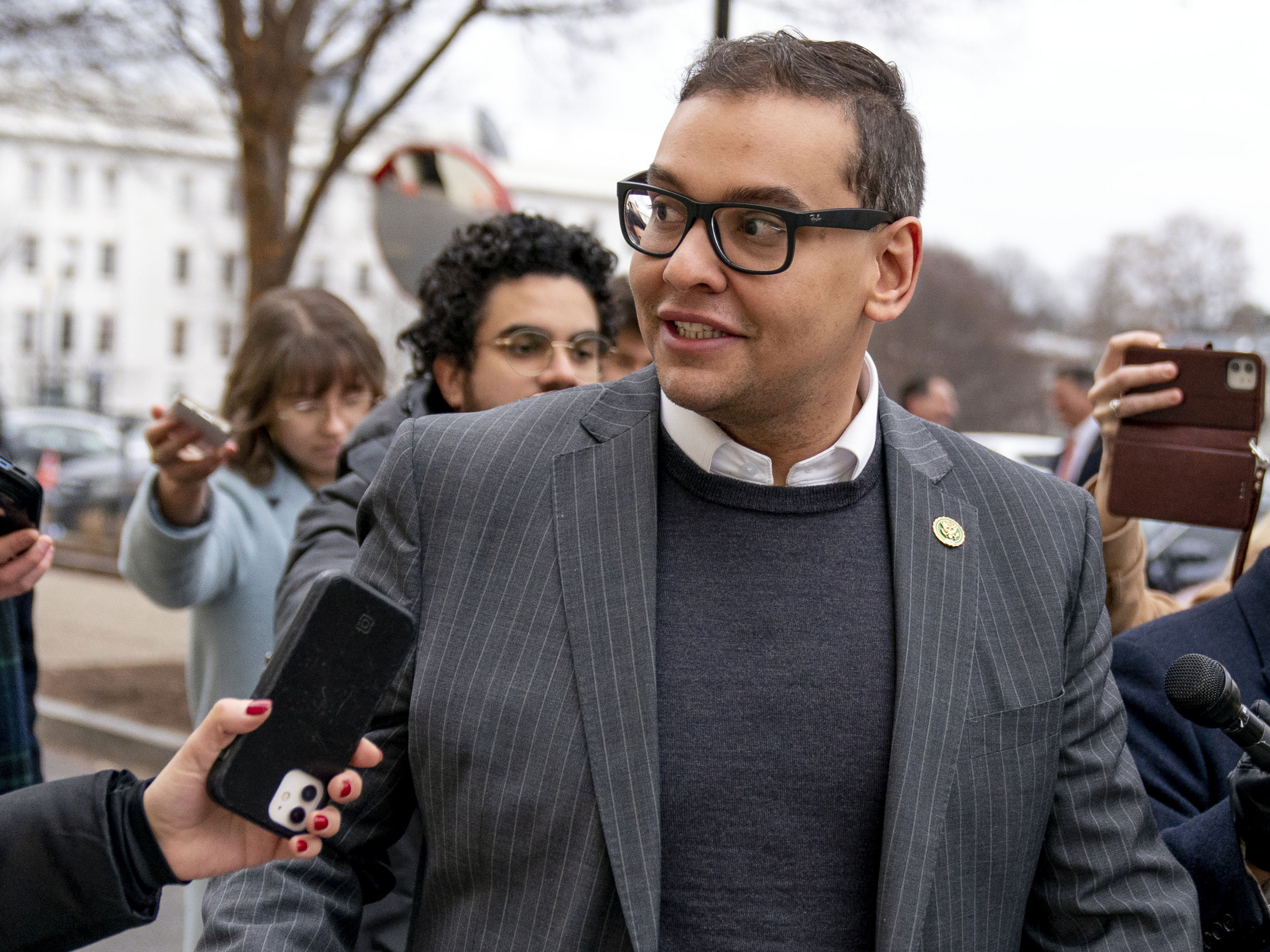 caption: U.S. Rep. George Santos, R-N.Y., leaves a House GOP conference meeting on Capitol Hill in Washington, Jan. 25, 2023.