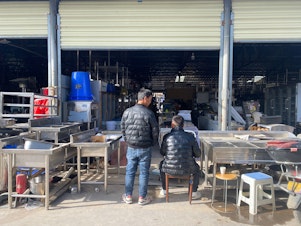 caption: An appliance market in Xi'an, China, where Jiang has a construction equipment rental company. He says economic conditions are worse now than during the pandemic, when he started the appliance business, and he isn't selling as much as he used to.