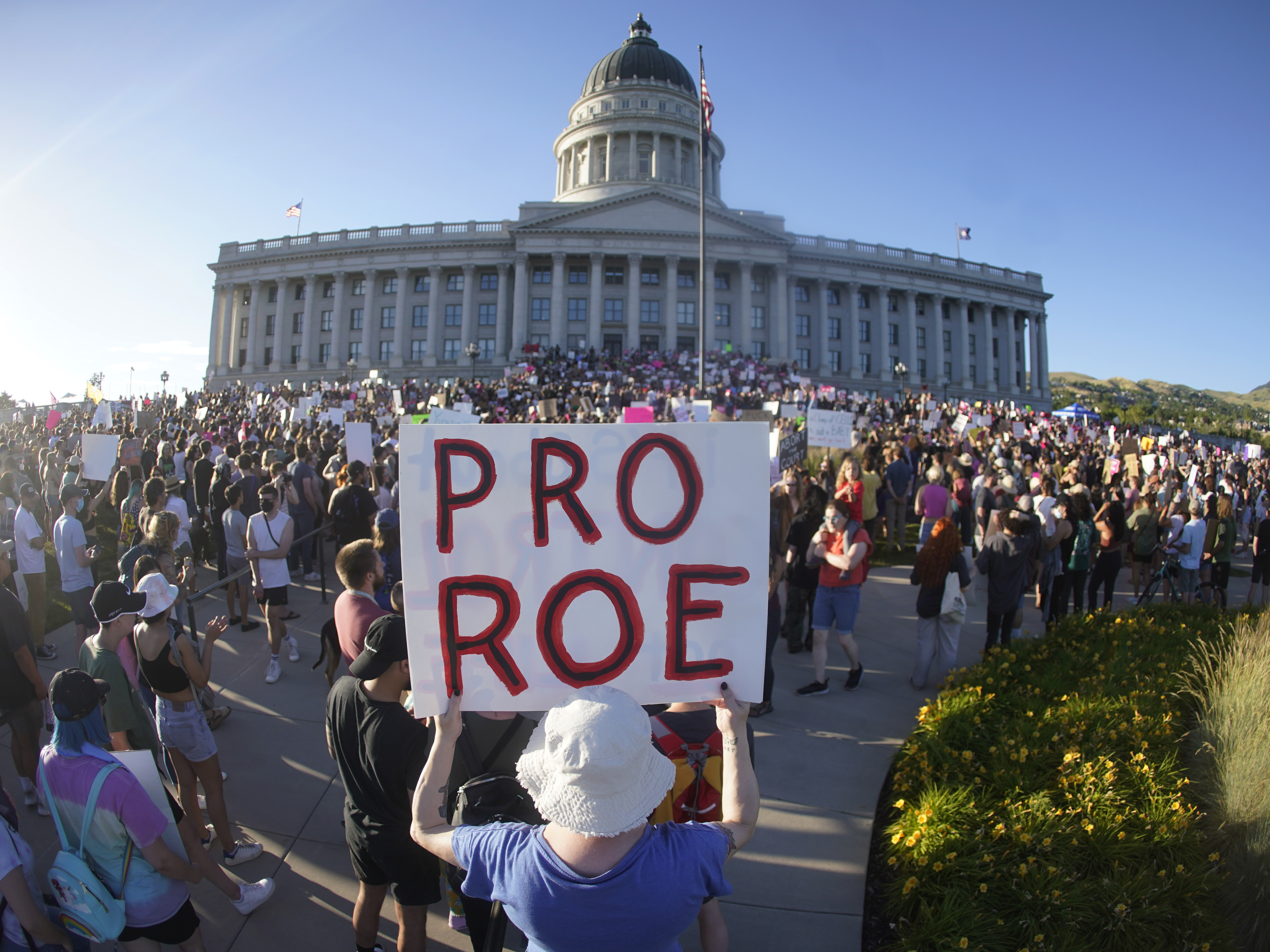 caption: People attend an abortion-rights protest at the Utah State Capitol in Salt Lake City on Friday after the U.S. Supreme Court overturned Roe v. Wade.